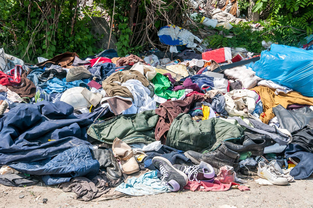 landfill of clothes causing environmental pollution