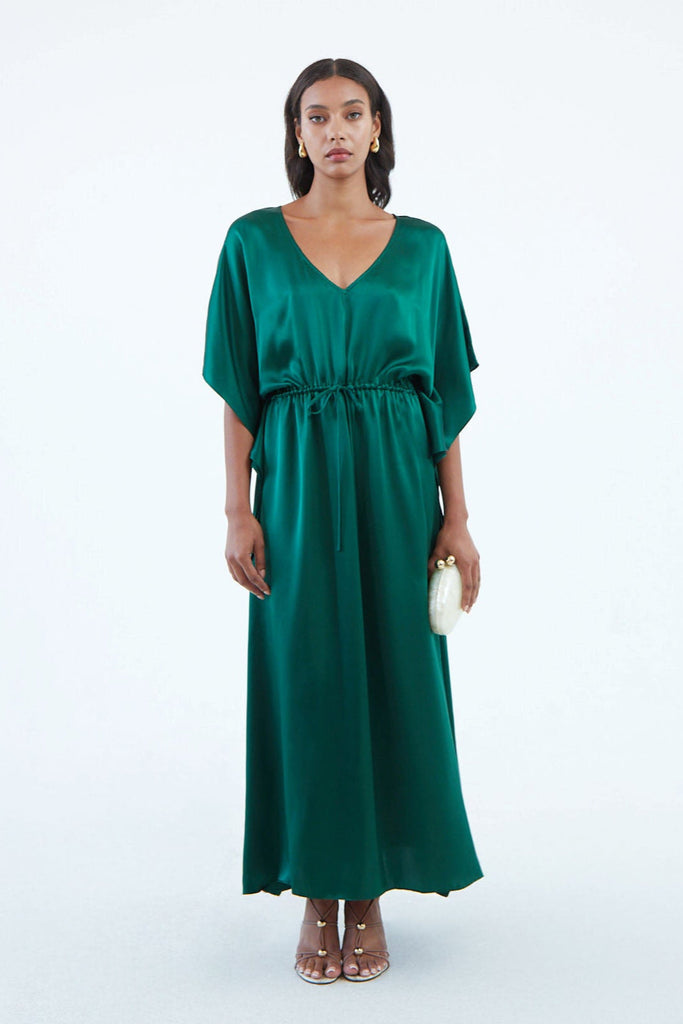 long emerald green silk kaftan dress with wide draped elbow-length sleeves, waist tie, and  low V neck
