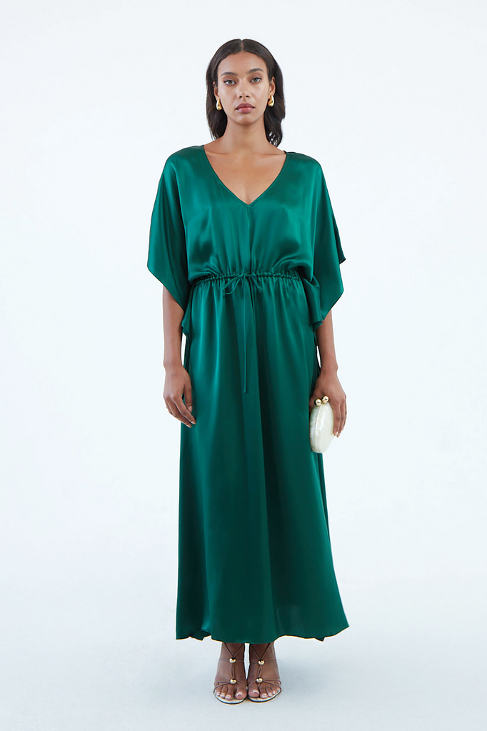long emerald green silk kaftan dress with wide draped elbow-length sleeves, waist tie, and  low V neck