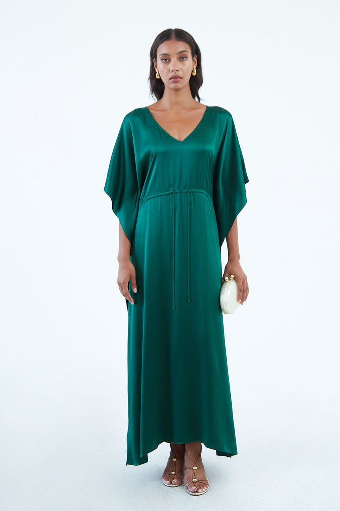long emerald green silk kaftan dress with wide draped elbow-length sleeves, waist tie, and  low V neck