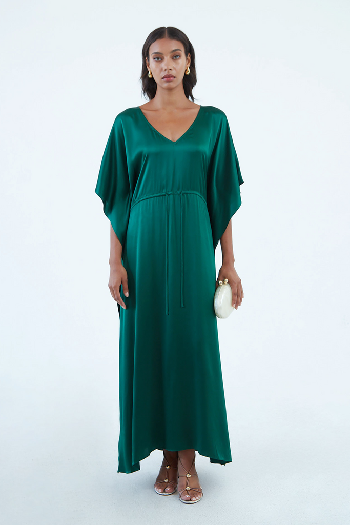 long emerald green silk kaftan dress with wide draped elbow-length sleeves, waist tie, and  low V neck