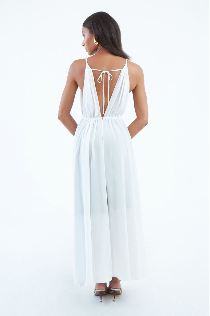 back of long white silk dress with top to bottom back slit, tied at waist and shoulder blade using tie string.