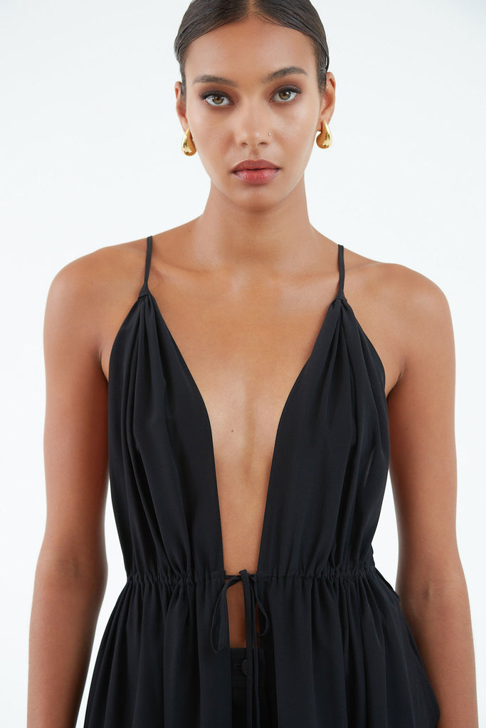 long black silk dress open front top to bottom, tied at waist with string.