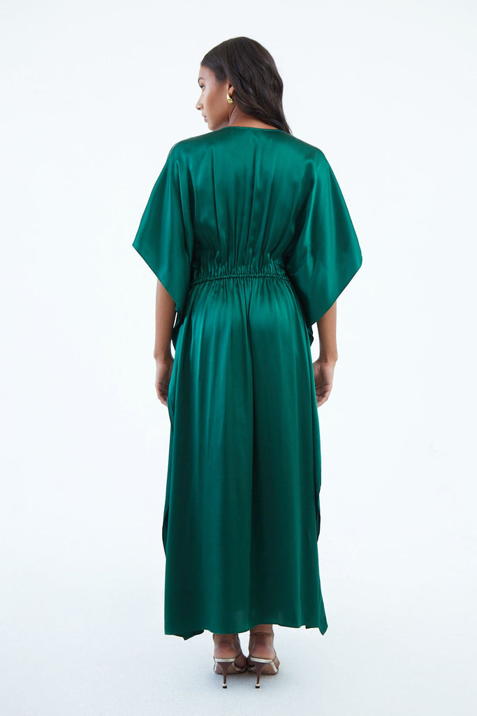 back of emerald green silk kaftan dress with waist elastic and wide elbow-length sleeves that extend to hem