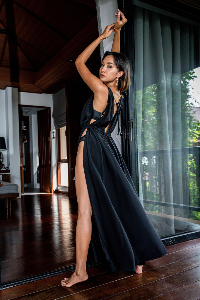 long black silk dress with top to bottom slits over lingerie